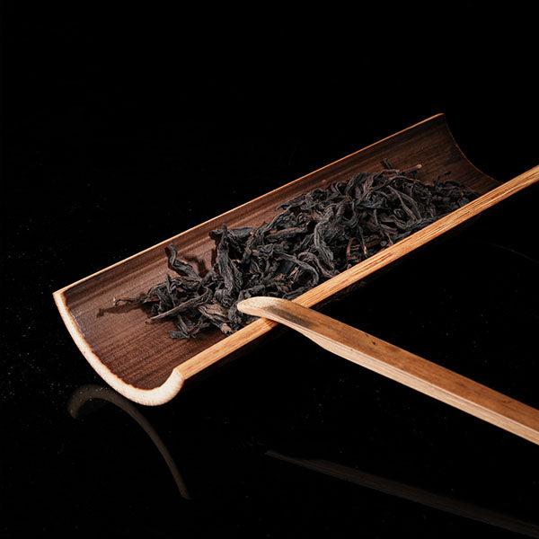 This is a bamboo tea measure carved from bamboo.