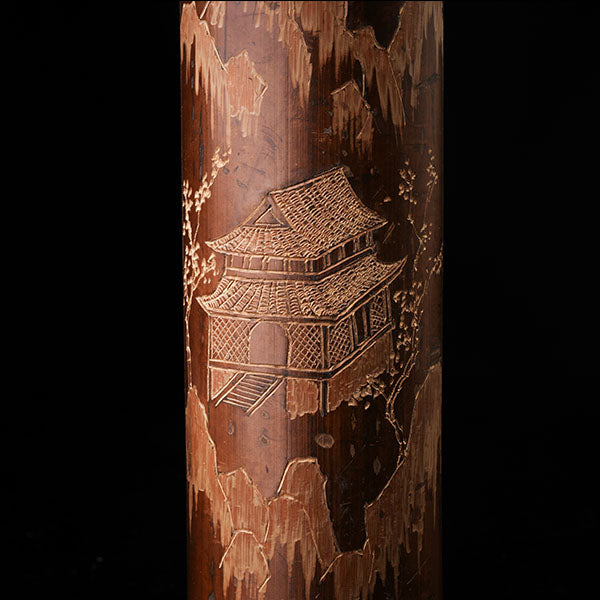 This is a bamboo house tea measure carved from bamboo.