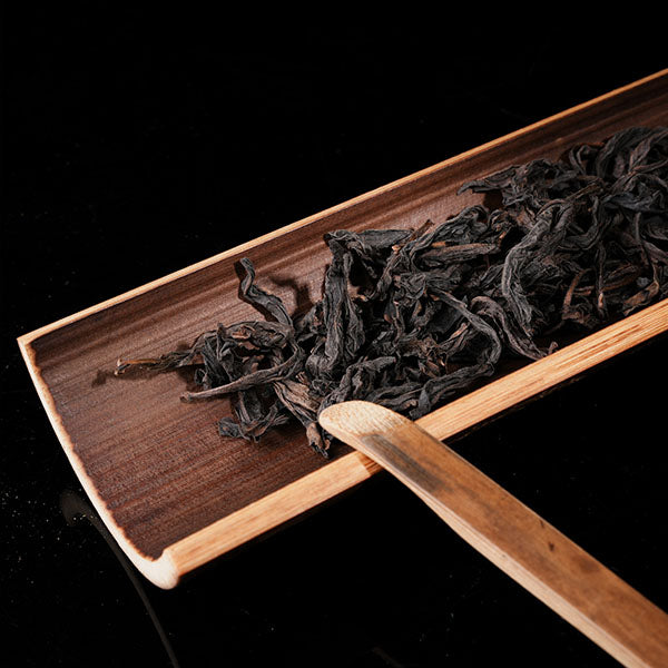 This is a bamboo house tea measure carved from bamboo.