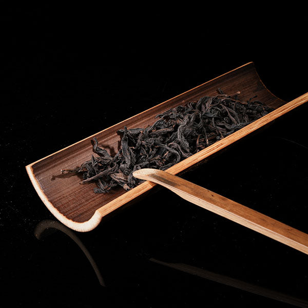 This is a bamboo house tea measure carved from bamboo.
