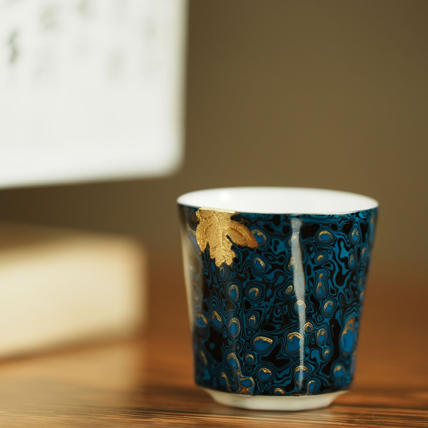 Host uses a blue peacock feather pattern as the base color with gold texture.