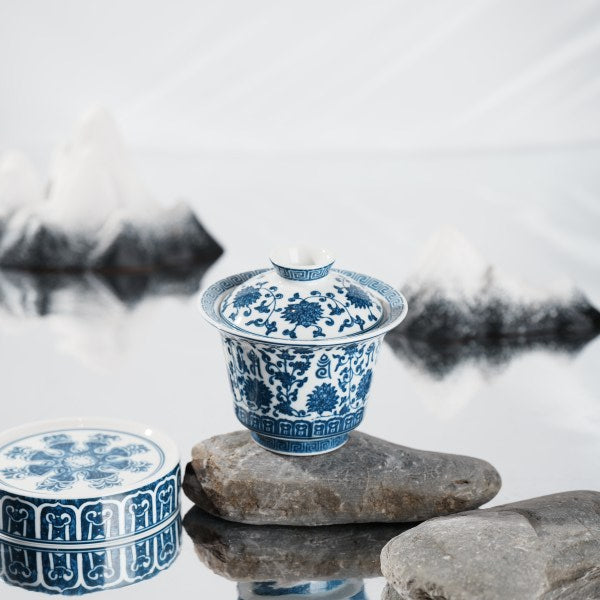 This is a lotus blue and white porcelain Gaiwan.
