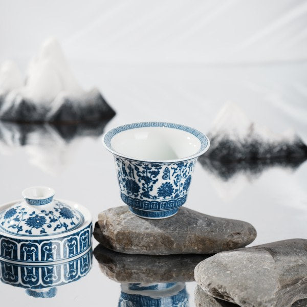 This is a lotus blue and white porcelain Gaiwan.