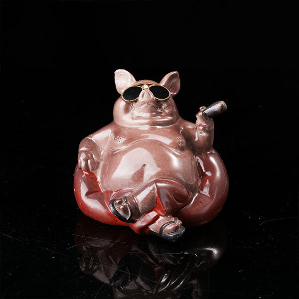Bully pig sitting on sofa, wearing sunglasses and smoking cigar.