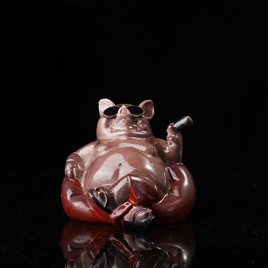 Bully pig sitting on sofa, wearing sunglasses and smoking cigar.