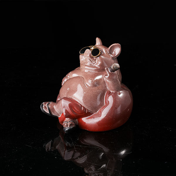 Bully pig sitting on sofa, wearing sunglasses and smoking cigar.