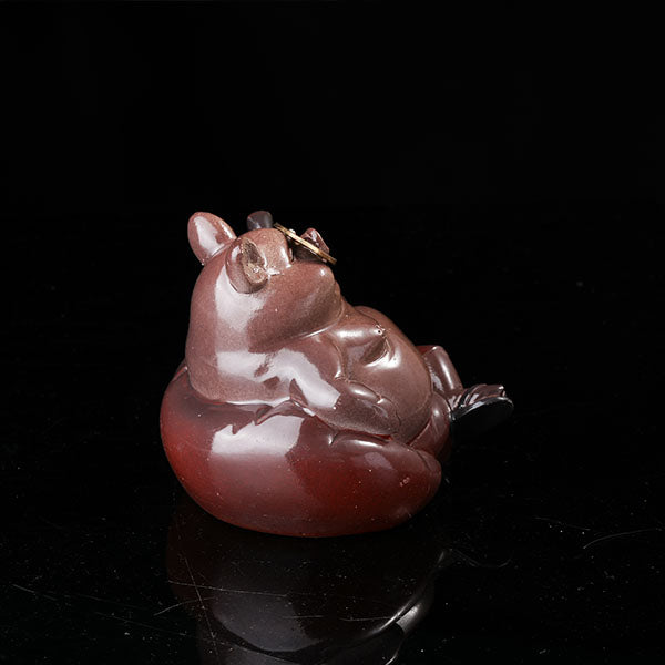Bully pig sitting on sofa, wearing sunglasses and smoking cigar.