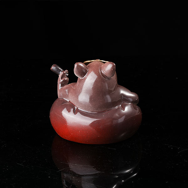Bully pig sitting on sofa, wearing sunglasses and smoking cigar.