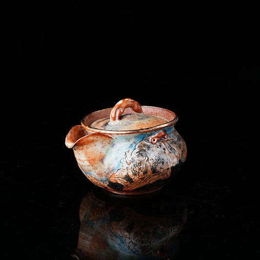 Classic of Mountains and Seas Teapot - Traditional ceramic teapot with rustic glaze, featuring mythical creature motifs inspired by Shan Hai Jing. Handcrafted, earthy tones, lid with handle, ideal for tea rituals. Showcases cultural artistry, intricate detailing, and functional elegance. Perfect for collectors of unique teaware, blending mythology with craftsmanship.