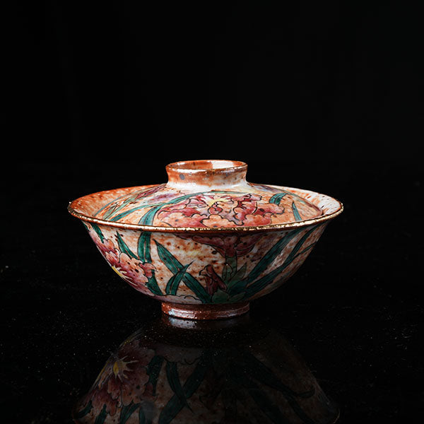 Gladdon Gaiwan - Traditional Chinese ceramic tea vessel with lid, adorned with hand-painted gladdon (iris) floral motifs, green leaves, and golden rim. Intricate craftsmanship, glossy glaze, ideal for tea ceremonies. Embodies cultural heritage, perfect for collectors of Asian porcelain. Highlights artistic detail, traditional design, and functional elegance.