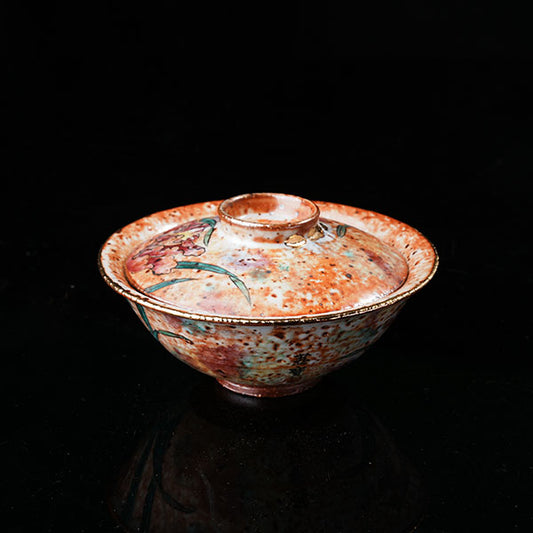 Gladdon Gaiwan - Traditional Chinese ceramic tea vessel with lid, adorned with hand-painted gladdon (iris) floral motifs, green leaves, and golden rim. Intricate craftsmanship, glossy glaze, ideal for tea ceremonies. Embodies cultural heritage, perfect for collectors of Asian porcelain. Highlights artistic detail, traditional design, and functional elegance.