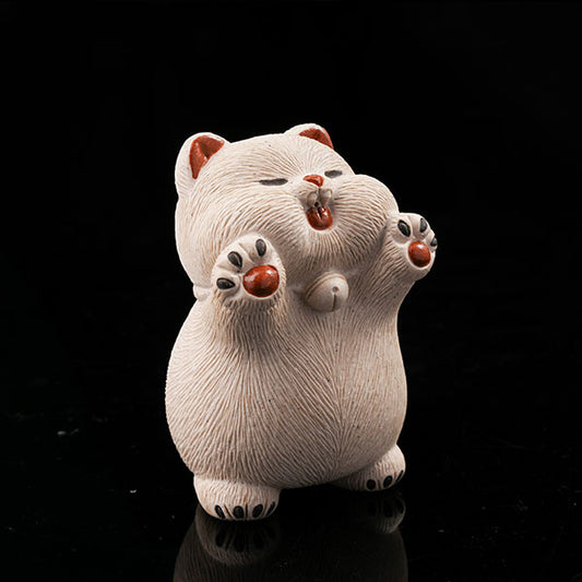 This is a hamster tea pet with its paws raised high, wanting to be hugged by its owner.