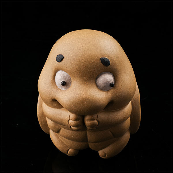 This is a cute little turtle tea pet.