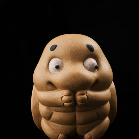 This is a cute little turtle tea pet.