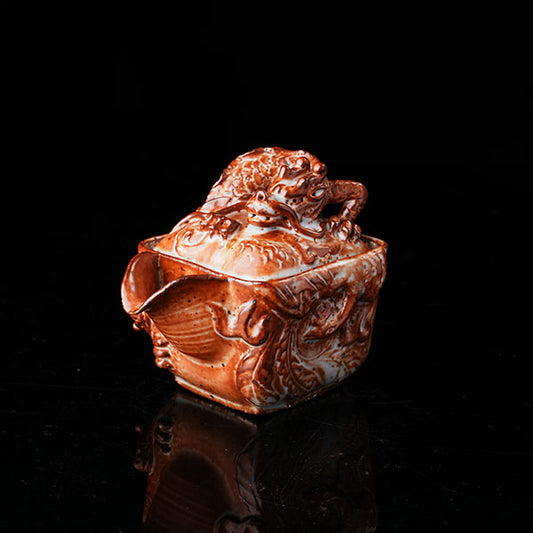 Loong Pattern Teapot - Traditional Chinese ceramic teapot featuring intricate dragon (loong) relief, rustic brown glaze, square shape, and dragon-adorned lid. Handcrafted, embodying cultural heritage, ideal for tea ceremonies. Showcases detailed artistry, perfect for collectors of Asian teaware, blending craftsmanship with functional elegance.