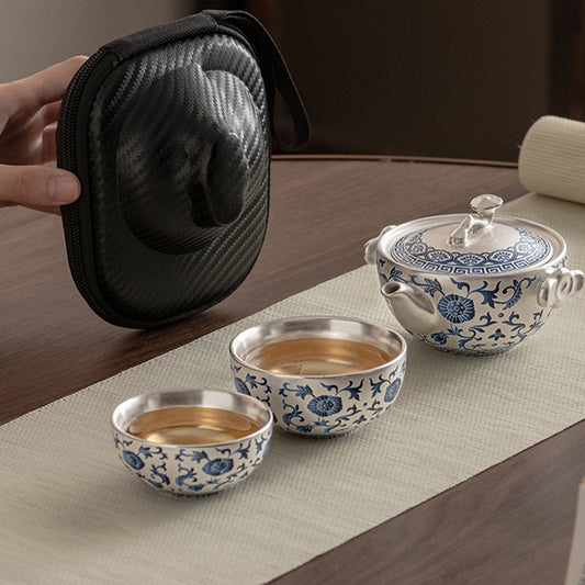 A silver-inlaid lotus-branch patterned teapot with two cups. Chaliland