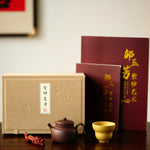 A teapot, a cup, and a tea pet gift box from Jiquan. Chaliland