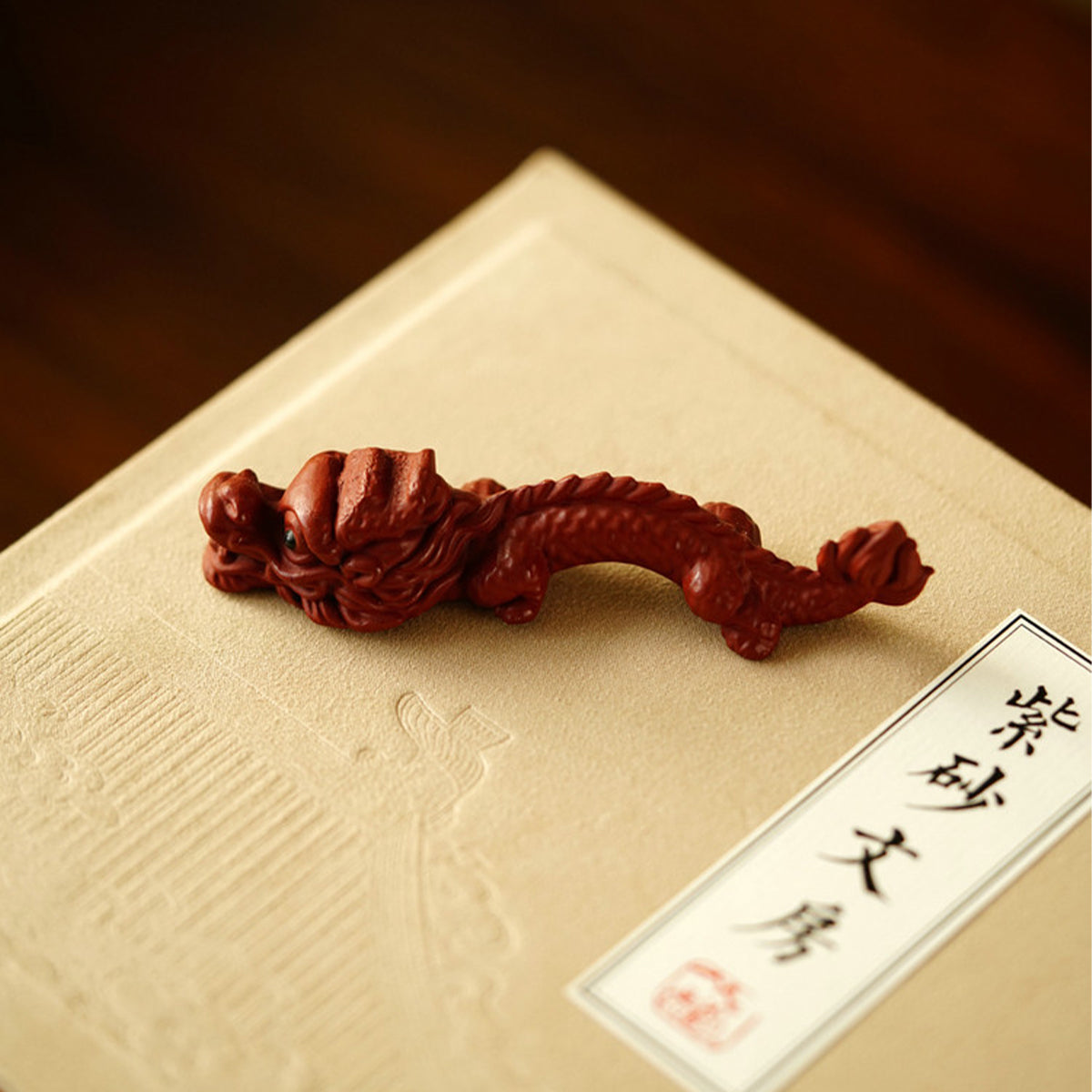 A teapot, a cup, and a tea pet gift box from Jiquan. Chaliland