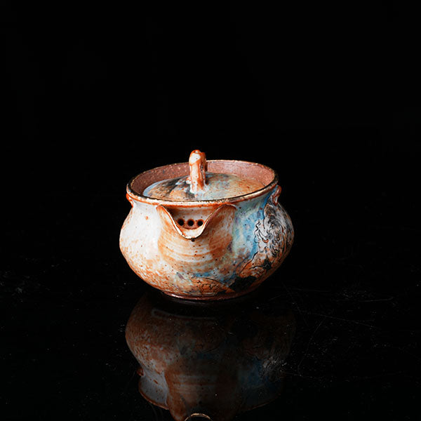 Classic of Mountains and Seas Teapot - Traditional ceramic teapot with rustic glaze, featuring mythical creature motifs inspired by Shan Hai Jing. Handcrafted, earthy tones, lid with handle, ideal for tea rituals. Showcases cultural artistry, intricate detailing, and functional elegance. Perfect for collectors of unique teaware, blending mythology with craftsmanship. 