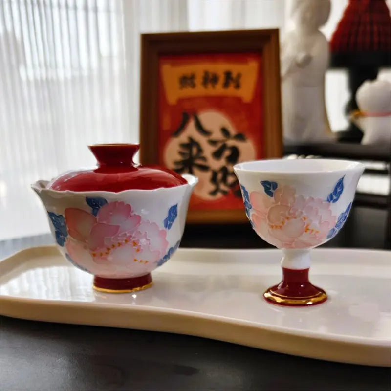 Hand-painted and gilded peony-shaped teacup with lid