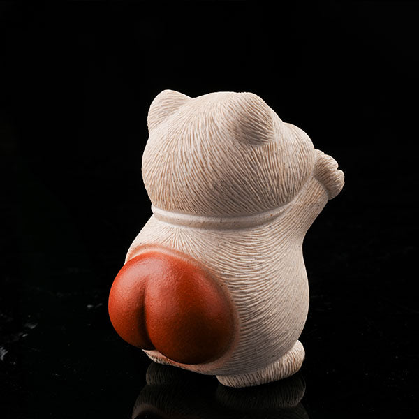 This is a hamster tea pet with its paws raised high, wanting to be hugged by its owner.