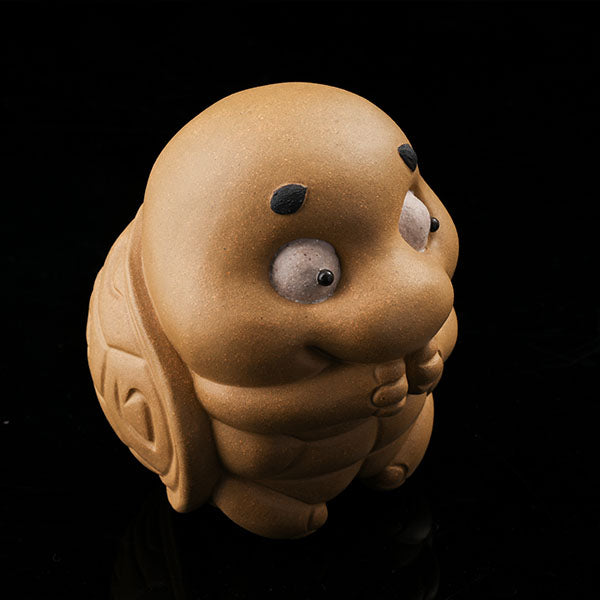 This is a cute little turtle tea pet.