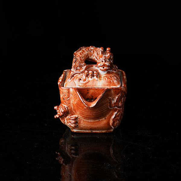 Loong Pattern Teapot - Traditional Chinese ceramic teapot featuring intricate dragon (loong) relief, rustic brown glaze, square shape, and dragon-adorned lid. Handcrafted, embodying cultural heritage, ideal for tea ceremonies. Showcases detailed artistry, perfect for collectors of Asian teaware, blending craftsmanship with functional elegance. 