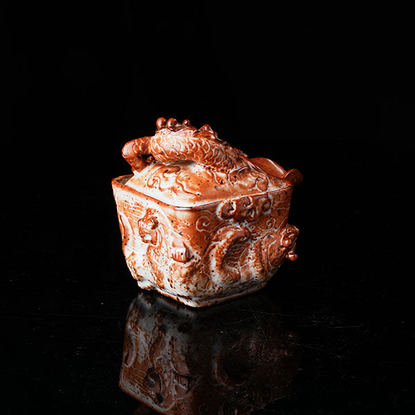 Loong Pattern Teapot - Traditional Chinese ceramic teapot featuring intricate dragon (loong) relief, rustic brown glaze, square shape, and dragon-adorned lid. Handcrafted, embodying cultural heritage, ideal for tea ceremonies. Showcases detailed artistry, perfect for collectors of Asian teaware, blending craftsmanship with functional elegance. 
