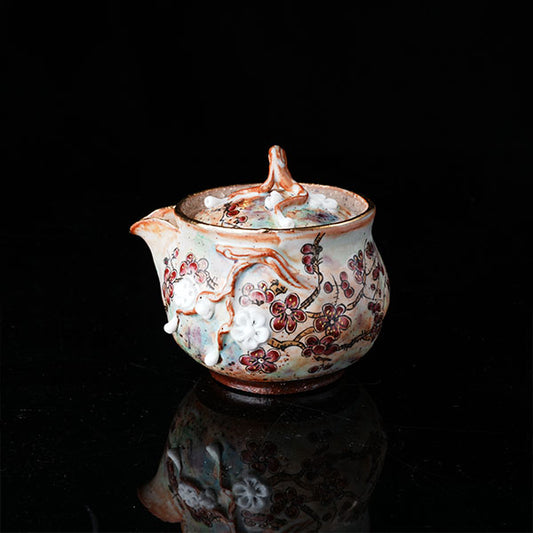 Plum Blossom Teapot - Handcrafted ceramic teapot with intricate plum blossom motifs, vibrant floral designs, and a rustic glaze. Features a branch-shaped lid handle, embodying traditional Chinese artistry. Ideal for tea ceremonies, showcasing cultural heritage and delicate craftsmanship. Perfect for collectors of floral-themed teaware, blending aesthetics with functional elegance.