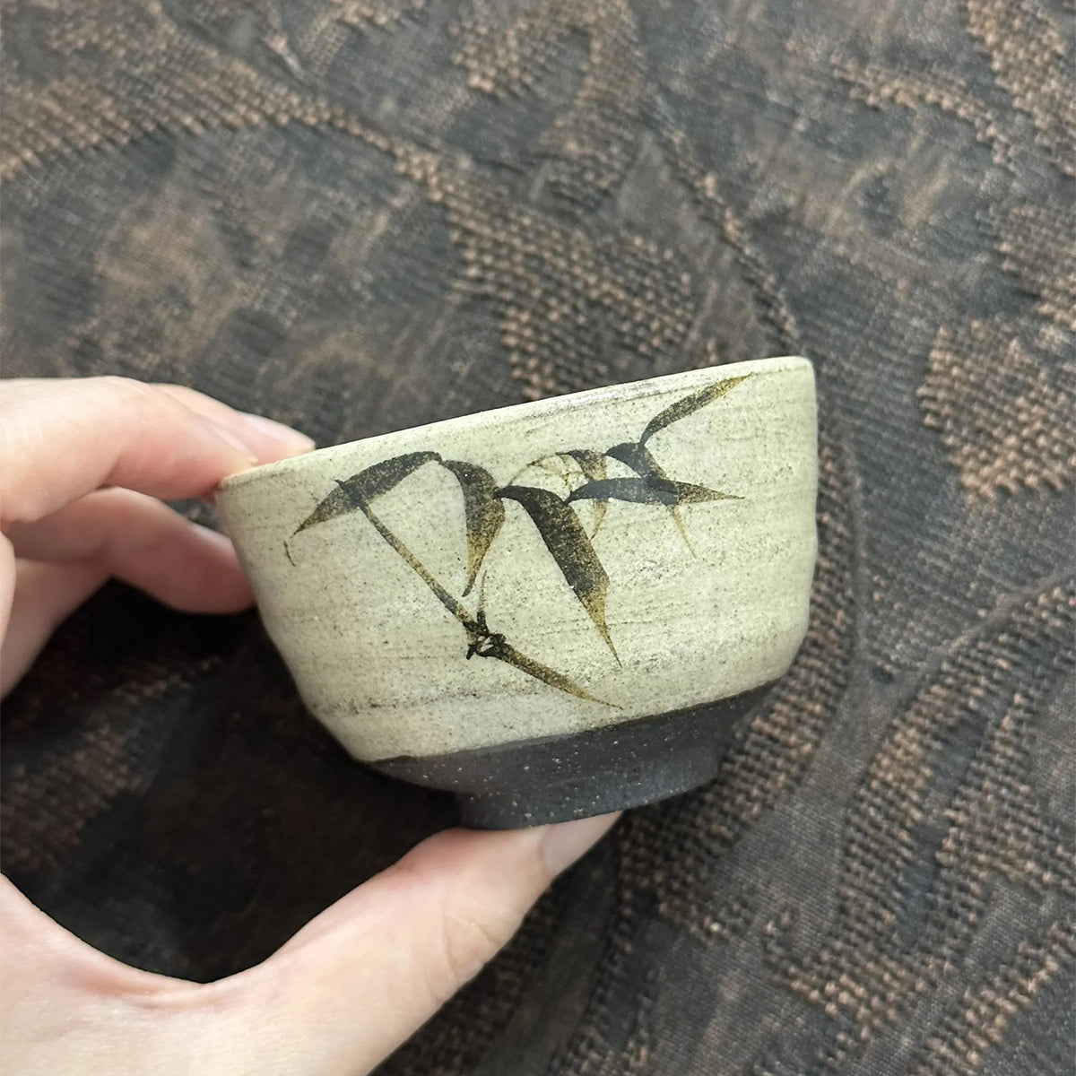 Powder-glazed iron-painted teacup