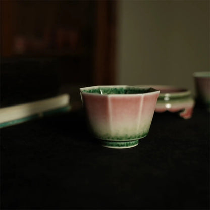 Red glaze cowpea and peach blossom pattern beauty cup, octagonal cup, master cup.