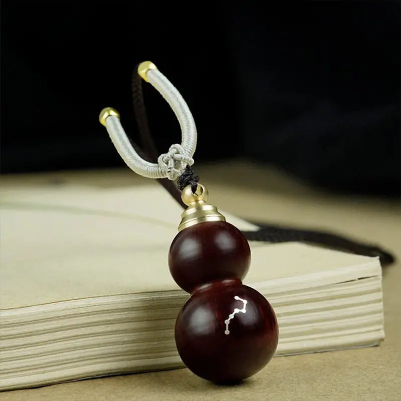 Rosewood inlaid silver Big Dipper gourd pendant