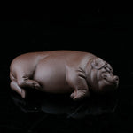 This is a pig tea pet that has fallen into a deep sleep.