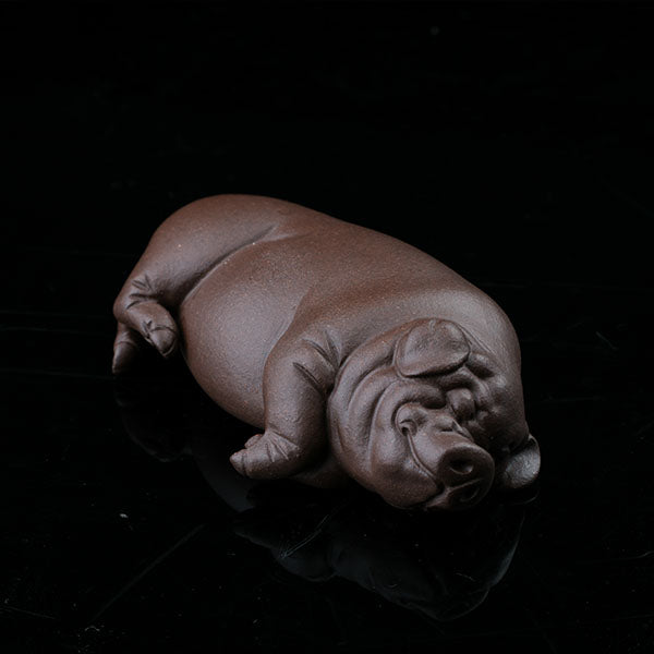 This is a pig tea pet that has fallen into a deep sleep.