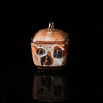 The Buddha without Form Square Teapot - Traditional ceramic teapot with square form, speckled brown glaze, gold handle, and relief figures (possibly Buddhist motifs). Handcrafted, rustic design, ideal for tea rituals. Features intricate detailing, cultural artistry, and functional elegance. Perfect for collectors of unique teaware, highlighting craftsmanship and traditional aesthetics.