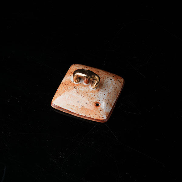 The Buddha without Form Square Teapot - Traditional ceramic teapot with square form, speckled brown glaze, gold handle, and relief figures (possibly Buddhist motifs). Handcrafted, rustic design, ideal for tea rituals. Features intricate detailing, cultural artistry, and functional elegance. Perfect for collectors of unique teaware, highlighting craftsmanship and traditional aesthetics.