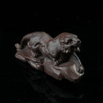 This is a tiger tea pet ready to go hunting.