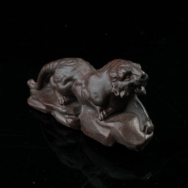 This is a tiger tea pet ready to go hunting.