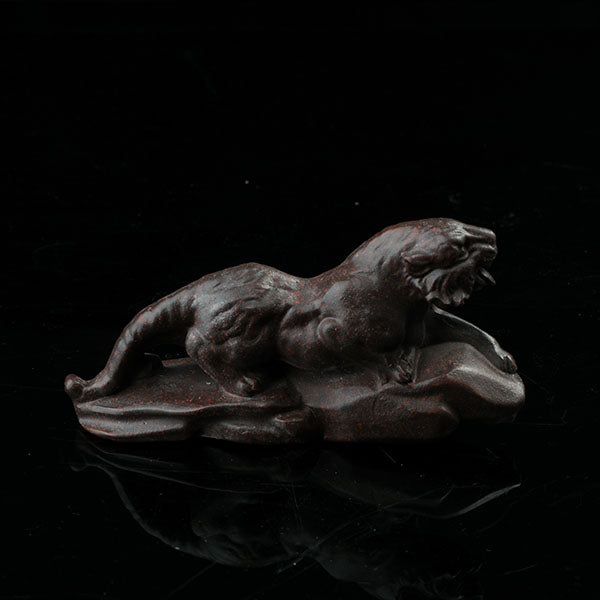 This is a tiger tea pet ready to go hunting.