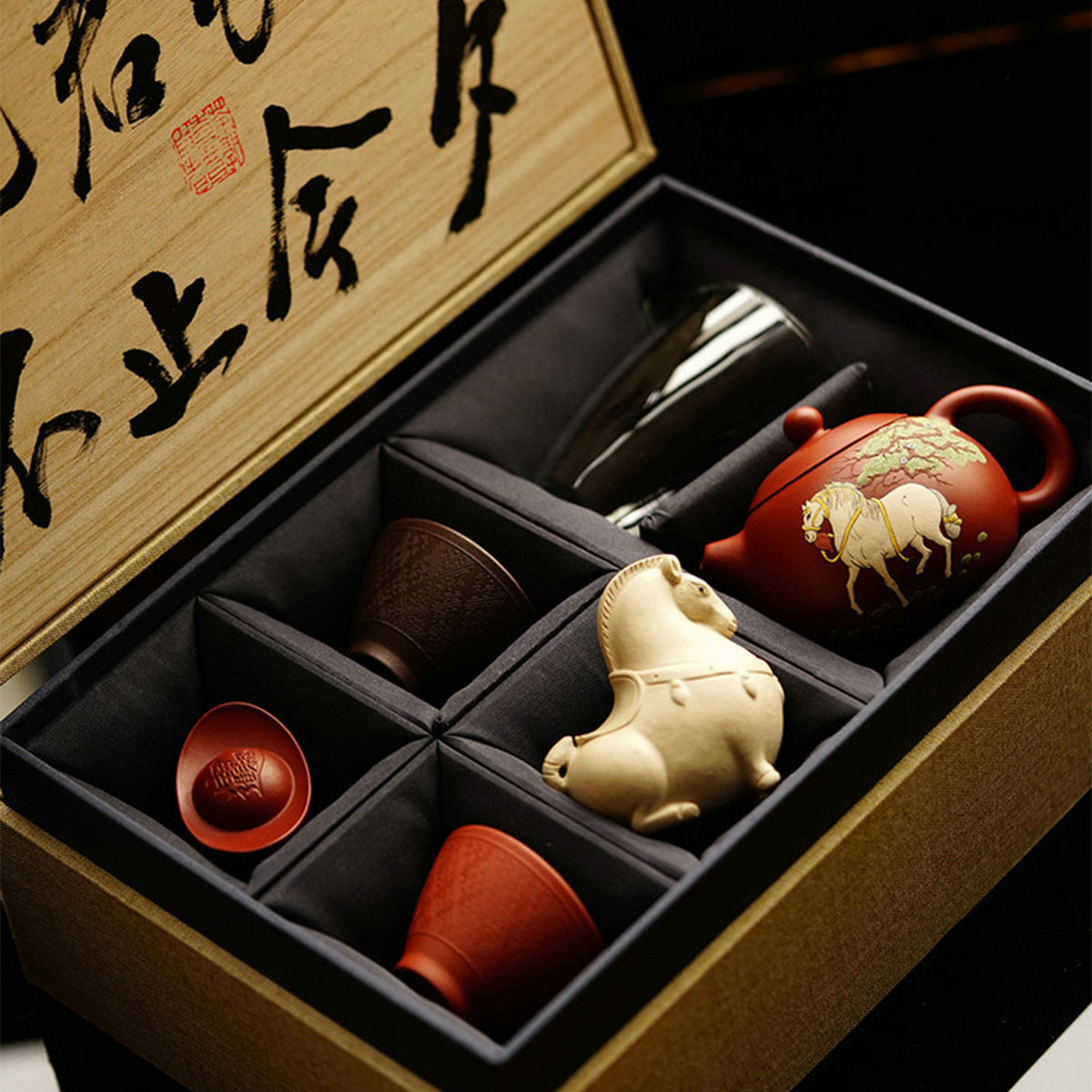 White Horse Xi Shi teapot, two teacups, two tea pets and one teacup. Chaliland