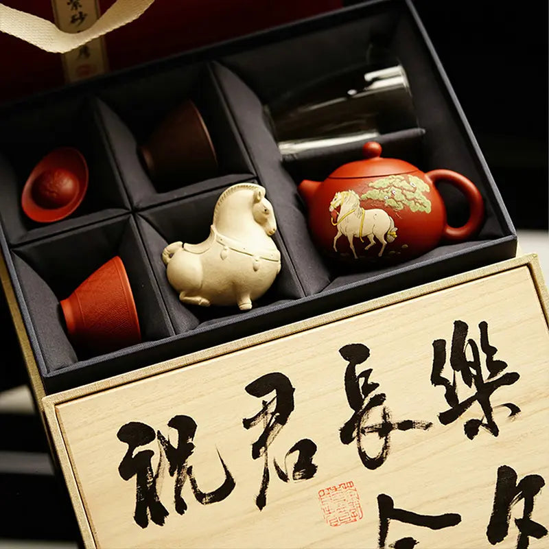 White Horse Xi Shi teapot, two teacups, two tea pets and one teacup.
